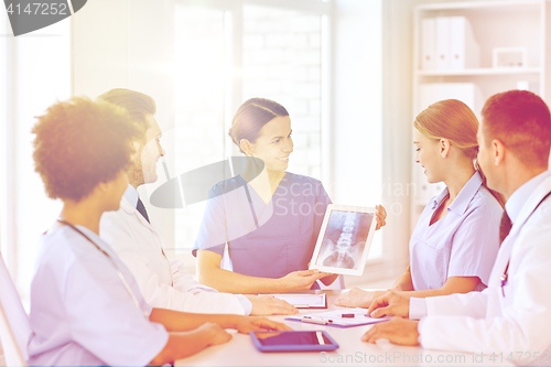 Image of group of happy doctors meeting at hospital office