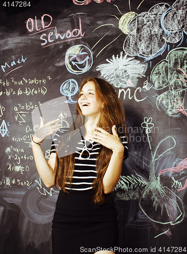 Image of back to school after summer vacations, cute teen real girl in classroom, lifestyle people concept