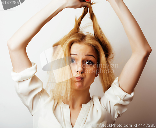 Image of young blond woman on white backgroung gesture thumbs up, isolate