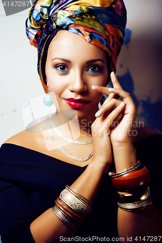 Image of beauty bright african woman with creative make up, shawl on head