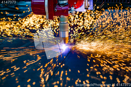 Image of CNC Laser plasma cutting of metal, modern industrial technology.