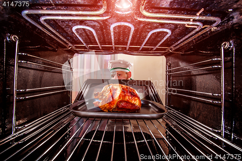 Image of Cooking chicken in the oven.