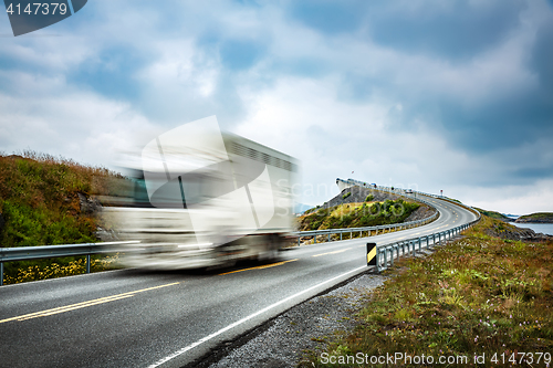 Image of Truck and highway at sunset