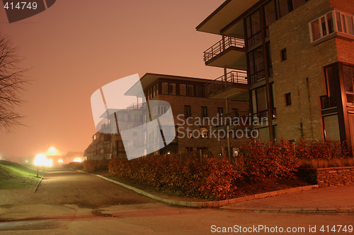 Image of Apartment building by night