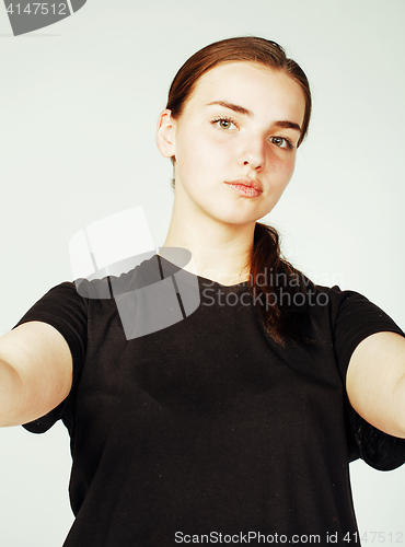 Image of young pretty teenage girl making selfie isolated on white backgr
