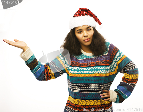 Image of cute young real african hipster girl in santas red hat isolated 