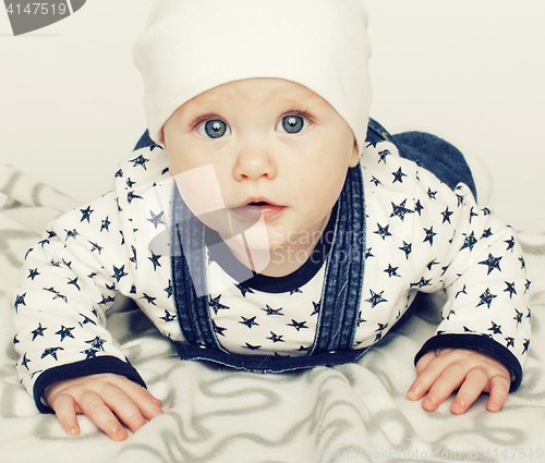 Image of little cute baby toddler on carpet isolated close up smiling ado