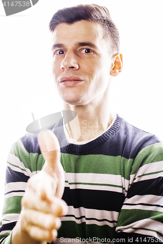 Image of Portrait of a smart serious young man standing against white bac