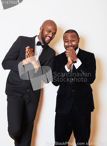 Image of two afro-american businessmen in black suits emotional posing, g