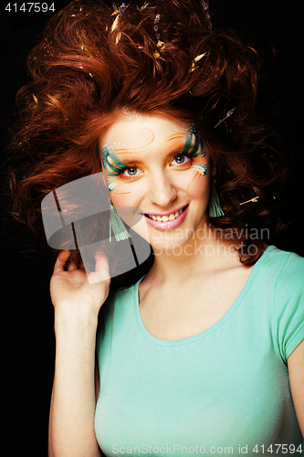 Image of pretty funny girl with art make up, closeup floral print on face