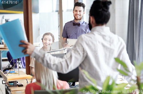 Image of happy creative team in office