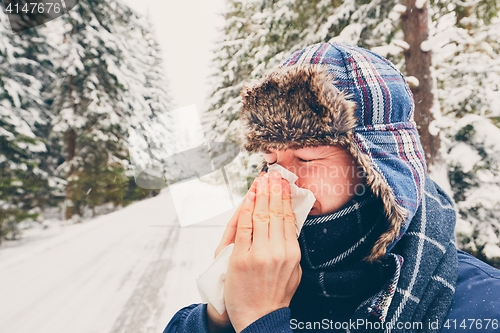 Image of Ill man in winter nature