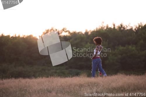 Image of young black woman in nature