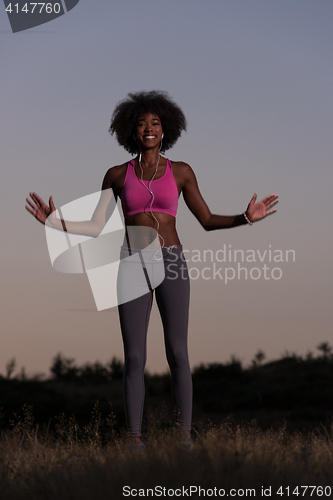 Image of black woman is doing stretching exercise relaxing and warm up
