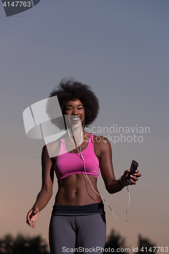 Image of black woman is doing stretching exercise relaxing and warm up