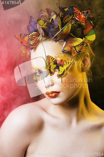 Image of woman with summer creative make up like fairy butterfly closeup 