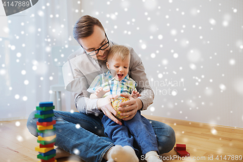 Image of father and son playing with ball clay at home