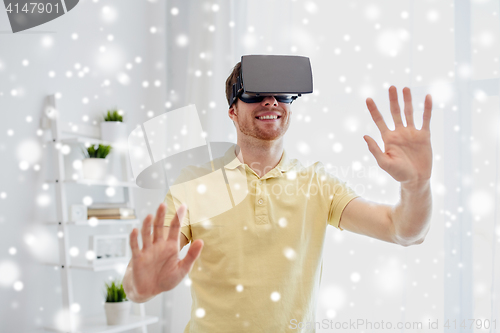 Image of young man in virtual reality headset or 3d glasses