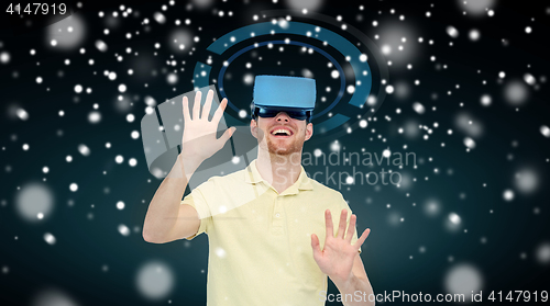 Image of happy man in virtual reality headset or 3d glasses