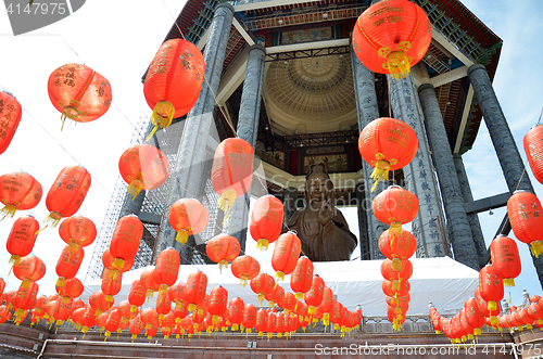 Image of Guanyin and a red lanterns in Chinese Temple Penang, Malaysia