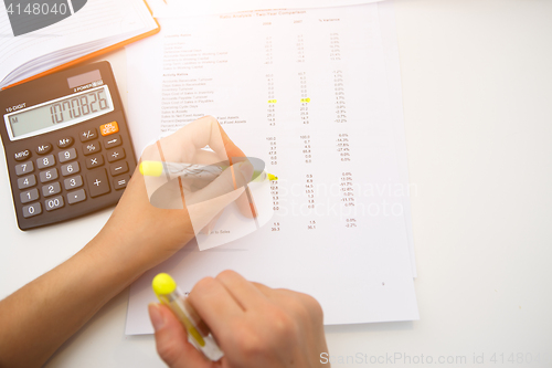 Image of Accountant working with paperwork, reports