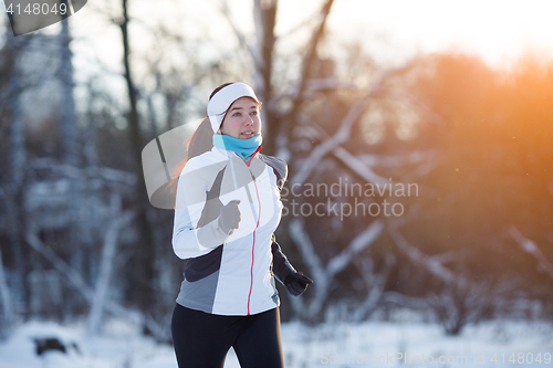 Image of Sport female in winter forest
