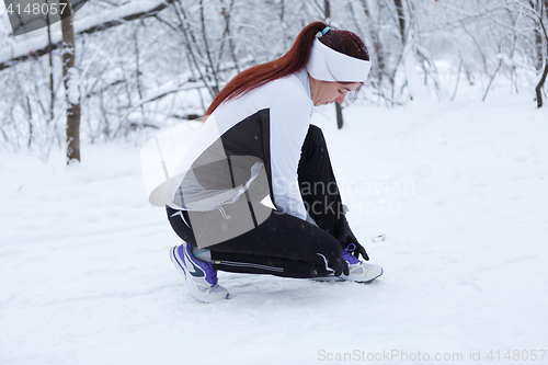Image of Sport girl in winter forest