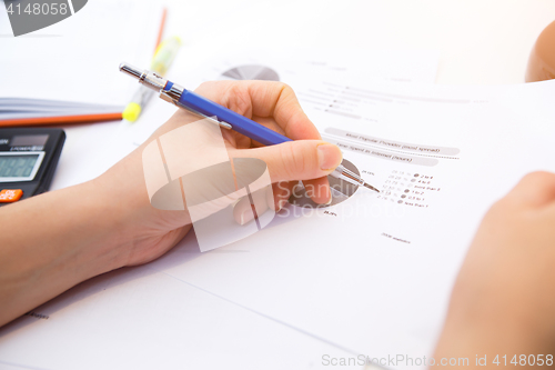 Image of Accountant operates with form , diagram