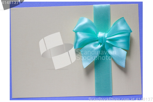 Image of Turquoise bow and ribbon on card