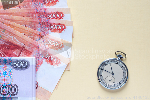 Image of Ruble banknotes and vintage watches