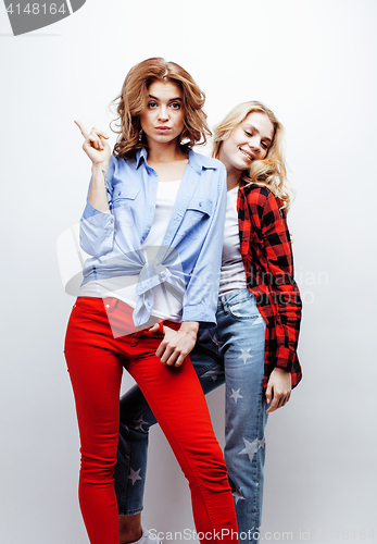 Image of two pretty blond woman having fun together on white background, mature mother and young teenage daughter, lifestyle people concept