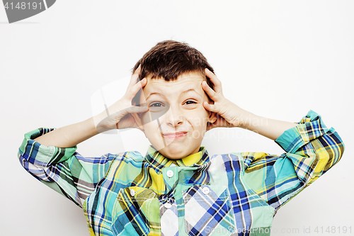 Image of young pretty little boy kid wondering, posing emotional face isolated on white background, gesture happy smiling close up, lifestyle people concept