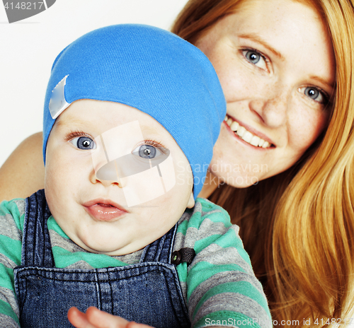 Image of young beauty mother with cute baby, red head happy modern family