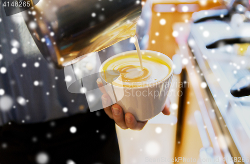 Image of close up of woman making coffee at shop or cafe