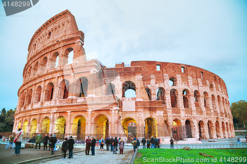 Image of The Colosseum with people at night