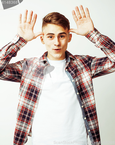 Image of young handsome teenage hipster guy posing emotional, happy smiling against white background isolated, lifestyle people concept