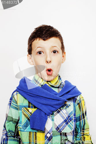 Image of young pretty little boy kid wondering, posing emotional face isolated on white background, gesture happy smiling close up, lifestyle people concept