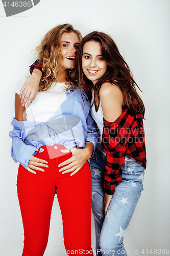 Image of two best friends teenage girls together having fun, posing emotional on white background, besties happy smiling, making selfie, lifestyle people concept