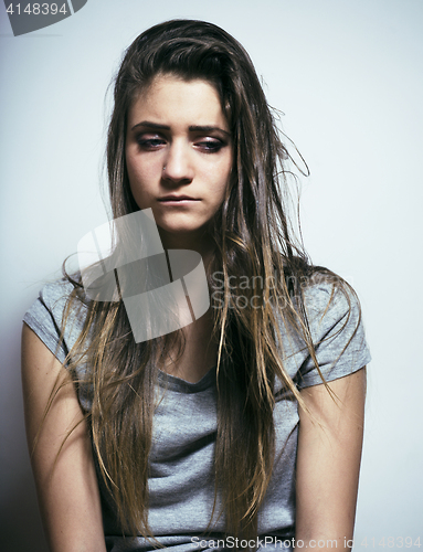 Image of problem depressioned teenage with messed hair and sad face, real junky bad looking girl close up