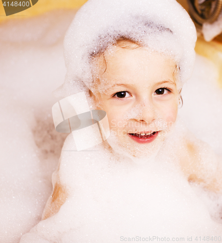 Image of little cute boy in bathroom with bubbles close up, lifestyle people concept