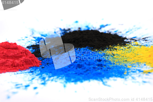 Image of cmyk toner powder (cyan, magenta, yellow, black)