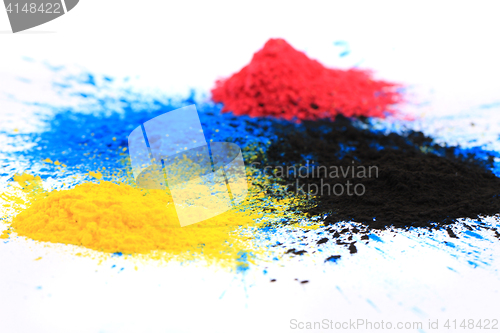 Image of cmyk toner powder (cyan, magenta, yellow, black)