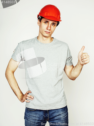Image of young real hard worker man isolated on white background on ladder smiling posing, business concept