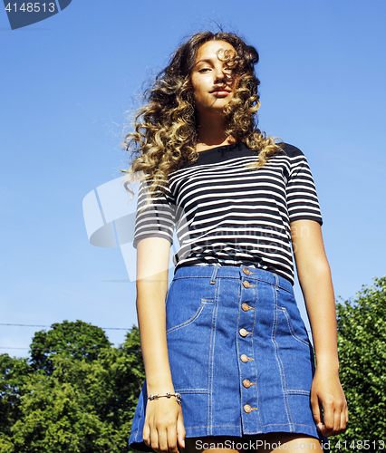 Image of young cute summer girl on green grass outside relaxing smiling close up sunny vacation, lifestyle people concept