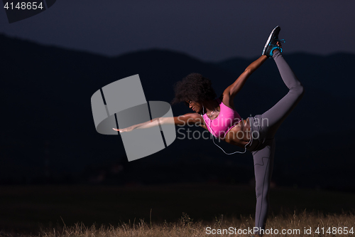 Image of black woman doing yoga  in the nature