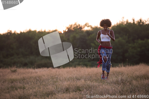 Image of young black woman in nature