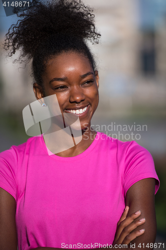 Image of Portrait of sporty young african american woman running outdoors