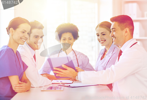 Image of group of happy doctors meeting at hospital office