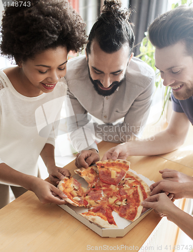 Image of happy business team eating pizza in office