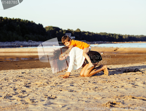 Image of pretty diverse nation and age friends on sea coast having fun, lifestyle people concept on beach vacations